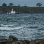 
              A Coast Guard ship patrols Weissenhaeuser Beach close to the Weissenhaus resort at Weissenhaeuser Strand, Germany, Thursday, May 12, 2022. The summit of foreign ministers from the G7 group of leading democratic economic powers is taking place at the resort on the Baltic Sea. (Axel Heimken/dpa via AP)
            