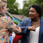 
              Georgia Democratic gubernatorial candidate Stacey Abrams greets a supporter during Georgia's primary election on Tuesday, May 24, 2022, in Atlanta. (AP Photo/Brynn Anderson)
            