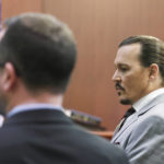 
              Actor Johnny Depp returns from a break in the courtroom in the Fairfax County Circuit Courthouse in Fairfax, Va., Thursday, May 26, 2022. Depp sued his ex-wife Amber Heard for libel in Fairfax County Circuit Court after she wrote an op-ed piece in The Washington Post in 2018 referring to herself as a "public figure representing domestic abuse." (Michael Reynolds/Pool Photo via AP)
            