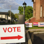 
              Signs point the way for voters to cast their ballots at the polling location for the Pennsylvania primary election, Tuesday, May 17, 2022, in Harmony, Pa., (AP Photo/Keith Srakocic)
            
