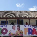 
              Supporters of Historical Pact coalition presidential candidate Gustavo Petro, hold an electoral banner of Petro and his running mate Francia Marquez during a closing campaign rally in Zipaquira, Colombia, Sunday, May 22, 2022. Elections are set for May 29. (AP Photo/Fernando Vergara)
            