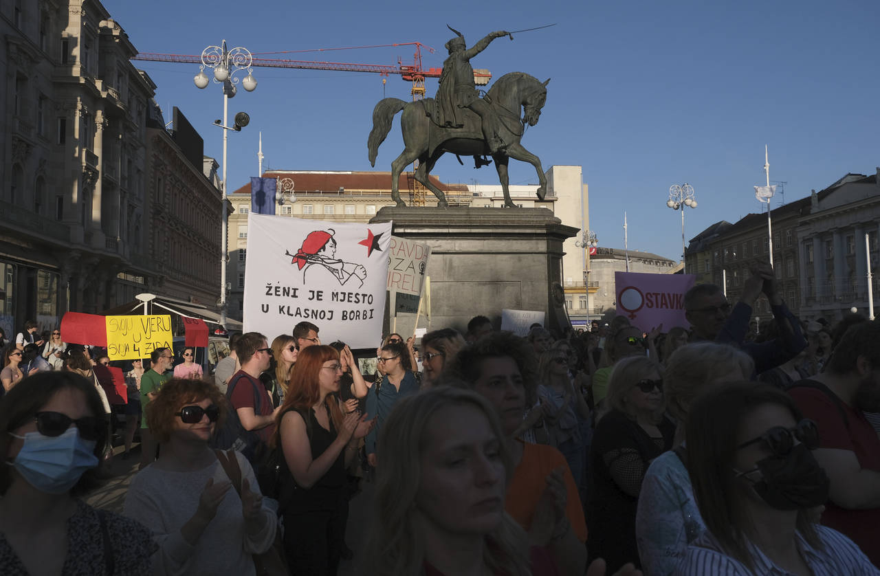People attend a protest in solidarity with a woman who was denied an abortion despite her fetus hav...