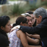 
              The archbishop of San Antonio, Gustavo Garcia-Siller, comforts families outside the Civic Center following a deadly school shooting at Robb Elementary School in Uvalde, Texas, Tuesday, May 24, 2022. (AP Photo/Dario Lopez-Mills)
            