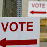 
              Signs point the way for voters to cast their ballots at the polling location for the Pennsylvania primary election, Tuesday, May 17, 2022, in Harmony, Pa., (AP Photo/Keith Srakocic)
            