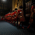 
              Yeomen Warders perform the ceremonial search of the Palace of Westminster prior to the State Opening of Parliament in London, Tuesday, May 10, 2022. Buckingham Palace said Queen Elizabeth II will not attend the opening of Parliament on Tuesday amid ongoing mobility issues. (AP Photo/Alastair Grant, Pool)
            