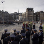 
              Wreaths are carried during a Remembrance Day ceremony at the national monument on Dam square in Amsterdam, Netherlands, Wednesday, May 4, 2022, commemorating civilians and members of the armed forces who have died in wars and peacekeeping missions since the start of the Second World War. (AP Photo/Peter Dejong)
            