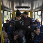 
              People ride in the bus during evacuation near Lyman, Ukraine, Wednesday, May 11, 2022. (AP Photo/Evgeniy Maloletka)
            