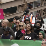 
              New York Attorney General Letitia James, front row third from right, marches with protestors across the Brooklyn Bridge during an abortion rights demonstration, Saturday, May 14, 2022, in New York. Demonstrators are rallying from coast to coast in the face of an anticipated Supreme Court decision that could overturn women's right to an abortion. (AP Photo/Jeenah Moon)
            