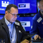 
              In this photo provided by the New York Stock Exchange, trader Edward Curran, left, and specialist Meric Greenbaum work on the floor, Wednesday, May 11, 2022. Stocks fell on Wall Street Wednesday after inflation slowed last month but still came in worse than feared. (Courtney Crow/New York Stock Exchange via AP)
            