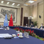 
              In this photo released by UN Human Rights Office, Chinese Foreign Minister Wang Yi at right meets with the United Nations High Commissioner for Human Rights Michelle Bachelet in Guangzhou, southern China's Guangdong Province on Monday, May 23, 2022. (UN Human Rights Office via AP)
            