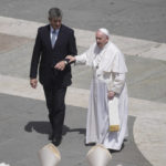 
              Pope Francis is helped walking at the end of the canonization mass for ten new saints in St. Peter's Square at The Vatican, Sunday, May 15, 2022. Francis created ten new saints on Sunday, rallying from knee pain that has forced him to use a wheelchair to preside over the first canonization ceremony at the Vatican in over two years. (AP Photo/Gregorio Borgia)
            