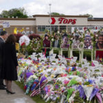 
              Vice President Kamala Harris and her husband Doug Emhoff visit a memorial near the site of the Buffalo supermarket shooting after attending a memorial service for Ruth Whitfield, one of the victims of the shooting, Saturday, May 28, 2022, in Buffalo, N.Y. (AP Photo/Patrick Semansky)
            