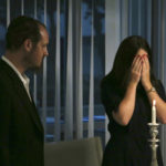 
              Mucha Duchman, right, stands next to her husband Rabbi Mendel Duchman, as she says a prayer for Shabbat at her apartment, where the couple hosts services for the community, in Dubai, United Arab Emirates, Friday, May 6, 2022. The fast-growing population of Jewish immigrants to the United Arab Emirates may feel freer than ever to express their identity in the autocratic Arab sheikhdom, which has sought to brand itself as an oasis of religious tolerance. But plans to build a permanent Jewish sanctuary for Dubai’s fast-expanding congregation have sputtered to a standstill, religious leaders say. (AP Photo/Isabel DeBre)
            