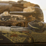 
              Painted coffins with well-preserved mummies inside, dating back to the Late Period of ancient Egypt around 500 B.C, are displayed at a makeshift exhibit at the feet of the Step Pyramid of Djoser in Saqqara, 24 kilometers (15 miles) southwest of Cairo, Egypt, Monday, May 30, 2022. (AP Photo/Amr Nabil)
            