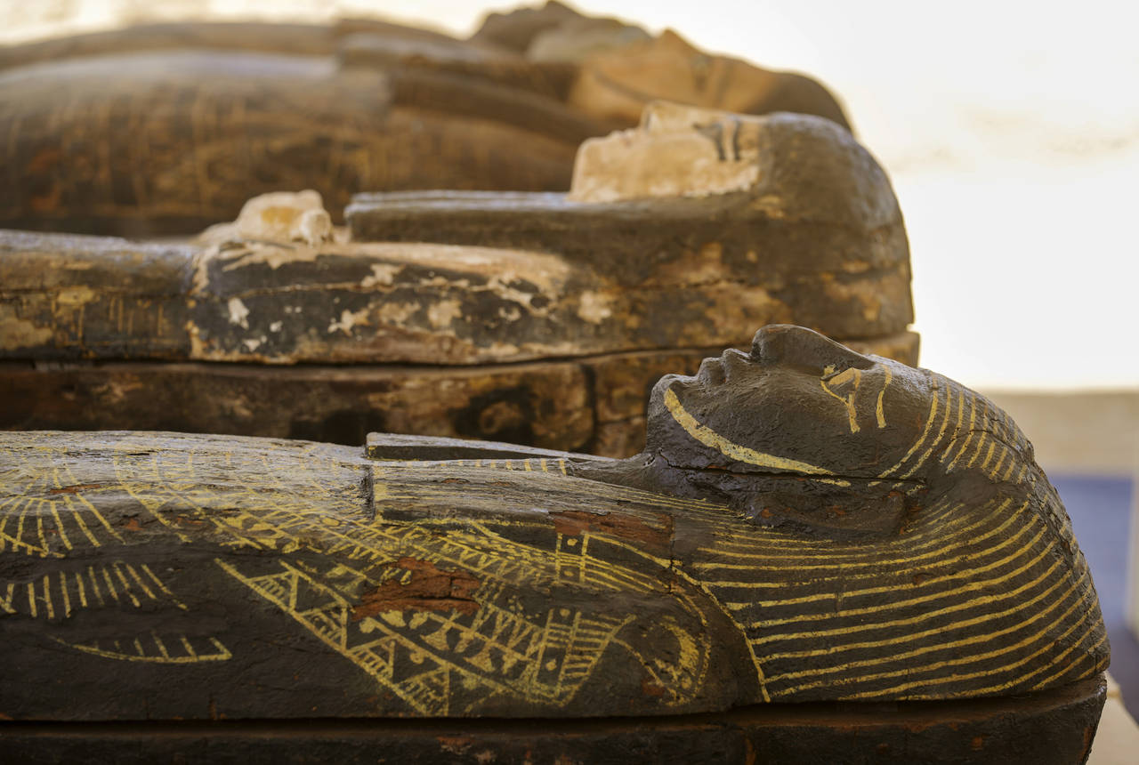 Painted coffins with well-preserved mummies inside, dating back to the Late Period of ancient Egypt...