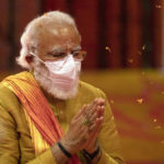 
              FILE- Indian Prime Minister Narendra Modi performs rituals during the groundbreaking ceremony of a temple dedicated to the Hindu god Ram, at the site of a demolished 16th century mosque, in Ayodhya, India on Aug. 5, 2020. Hindus believe the site of the mosque was the exact birthplace of their god Ram. Its demolition in 1992 sparked massive communal violence across India that left more than 2,000 people dead, mostly Muslims, and catapulted Prime Minister Narendra Modi's Bharatiya Janata Party to national prominence. (AP Photo/Rajesh Kumar Singh, File)
            