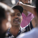 
              A man shouts slogans during the the cremation of Rahul Bhat, a government employee killed on Thursday, in Jammu, India, Friday, May 13, 2022. Bhat, who was a minority Kashmiri Hindu known as "pandits," was killed by suspected rebels inside his office in Chadoora town in the Indian portion of Kashmir. (AP Photo/Channi Anand)
            