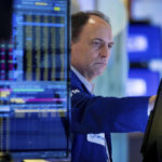 
              In this photo provided by the New York Stock Exchange, trader James Conti works on the floor, Friday, May 20, 2022. Another drop for stocks on Friday has pushed the S&P 500 index 20% below its peak set early this year. (Allie Joseph/New York Stock Exchange via AP)
            