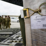 
              Agriculture Secretary Tom Vilsack, left, greets crew members of a C-17 that delivered a plane load of baby formula at the Indianapolis International Airport in Indianapolis, Sunday, May 22, 2022. The 132 pallets of Nestlé Health Science Alfamino Infant and Alfamino Junior formula arrived from Ramstein Air Base in Germany (AP Photo/Michael Conroy)
            