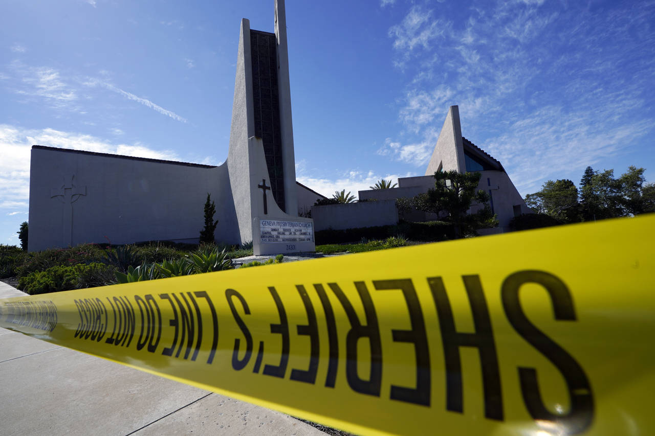 Crime scene tape is stretched across an area at Geneva Presbyterian Church in Laguna Woods, Calif.,...
