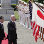 
              U.S. President Joe Biden, right, and Japan's Prime Minister Fumio Kishida review an honor guard during a welcome ceremony for President Biden, at the Akasaka Palace state guest house in Tokyo, Japan, Monday, May 23, 2022. (AP Photo/Eugene Hoshiko, Pool)
            