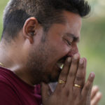 
              A man mourns during the cremation of a relative Rahul Bhat, who was a minority Kashmiri Hindu known as "pandits," killed on Thursday, in Jammu, India, Friday, May 13, 2022. Bhat, who was a government employee, was killed by suspected rebels inside his office in Chadoora town in the Indian portion of Kashmir. (AP Photo/Channi Anand)
            