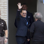 
              Actor Johnny Depp waves to supporters outside of Fairfax County Courthouse in Fairfax, Va., on Friday, May 27, 2022. A jury is scheduled to hear closing arguments in Depp's high-profile libel lawsuit against ex-wife Amber Heard.(AP Photo/Craig Hudson)
            