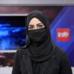 
              Khatereh Ahmadi a TV anchor wears a face covering as she reads the news on TOLO NEWS, in Kabul, Afghanistan, Sunday, May 22, 2022. Afghanistan's Taliban rulers have begun enforcing an order requiring all female TV news anchors in the country to cover their faces while on-air. The move Sunday is part of a hard-line shift drawing condemnation from rights activists. (AP Photo/Ebrahim Noroozi)
            