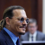 
              Actor Johnny Depp arrives in the courtroom after lunch, at the Fairfax County Circuit Court in Fairfax, Va., Monday May 2, 2022. Depp sued his ex-wife Amber Heard for libel in Fairfax County Circuit Court after she wrote an op-ed piece in The Washington Post in 2018 referring to herself as a "public figure representing domestic abuse."(AP Photo/Steve Helber, Pool)
            