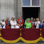 
              FILE - Britain's Queen Elizabeth II waves as she watches the flypast, with Prince Philip, to right, Prince William, centre, with his son Prince George, front, Kate, Duchess of Cambridge holding Princess Charlotte, centre left, with The Prince of Wales standing with The Duchess of Cornwall, and Princess Anne, fourth left, on the balcony during the Trooping The Colour parade at Buckingham Palace, in London, on June 11, 2016. (AP Photo/Tim Ireland, File)
            