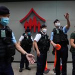 
              Police officers set up a demonstration area near a polling station in Hong Kong, Sunday, May 8, 2022. A Hong Kong election committee is voting Sunday for the city’s only leadership candidate, John Lee, who is widely expected to win and become Hong Kong’s next chief executive. (AP Photo/Kin Cheung)
            