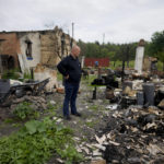
              Eduard Zelenskyy stands outside his home destroyed by attacks in Potashnya, on the outskirts of Kyiv, Ukraine, Tuesday, May 31, 2022. Zelenskyy just returned to his home town after escaping war to find out he is homeless. (AP Photo/Natacha Pisarenko)
            