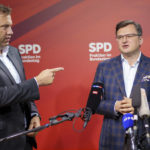 
              Lars Klingbeil, left, co-chairman of the German Social Democrats (SPD), points towards Ukrainian Foreign Minister Dmytro Kuleba, right, after a meeting at the German federal parliament, Bundestag, in the Reichstag building in Berlin, Germany, Thursday, May 12, 2022. (Michael Kappeler/dpa via AP)
            