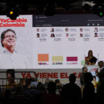 
              Partial results for presidential elections are shown on a screen where supporters of Gustavo Petro, presidential candidate with the Historical Pact coalition, gather after polls closed in Bogota, Colombia, Sunday, May 29, 2022. (AP Photo/Fernando Vergara)
            