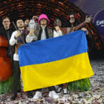 
              Kalush Orchestra from Ukraine celebrate after winning the Grand Final of the Eurovision Song Contest at Palaolimpico arena, in Turin, Italy, Saturday, May 14, 2022. (AP Photo/Luca Bruno)
            