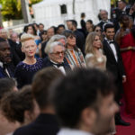 
              Tilda Swinton, centre, poses with Idris Elba, centre left and director George Miller upon arrival at the premiere of the film 'Three Thousand Years of Longing' at the 75th international film festival, Cannes, southern France, Friday, May 20, 2022. (AP Photo/Daniel Cole)
            