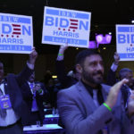 
              Members of the crowd hold up signs as President Joe Biden speaks at the 40th International Brotherhood of Electrical Workers (IBEW) International Convention at McCormick Place, Wednesday, May 11, 2022, in Chicago. (AP Photo/Andrew Harnik)
            