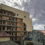 
              A view of the damaged Hotel Saratoga and the 19th century dome of the Calvary Baptist Church, in Old Havana, Cuba, Wednesday, May 11, 2022. The May 6th explosion that devastated the hotel and killed dozens also badly damaged Cuba's most important Baptist church, which sits next door.  (AP Photo/Ramon Espinosa)
            