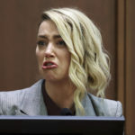 
              Actor Amber Heard testifies in the courtroom in the Fairfax County Circuit Courthouse in Fairfax, Va., Thursday, May 26, 2022. Actor Johnny Depp sued his ex-wife Amber Heard for libel in Fairfax County Circuit Court after she wrote an op-ed piece in The Washington Post in 2018 referring to herself as a "public figure representing domestic abuse." (Michael Reynolds/Pool Photo via AP)
            