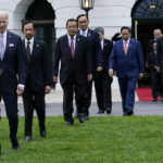 
              President Joe Biden and leaders from the Association of Southeast Asian Nations (ASEAN) arrive for a group photo on the South Lawn of the White House in Washington, Thursday, May 12, 2022. (AP Photo/Susan Walsh)
            