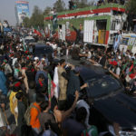 
              Supporters of Pakistan’s defiant former Prime Minister Imran Khan take part in an anti-government rally in Islamabad, Pakistan, Thursday, May 26, 2022. Khan early Thursday warned Pakistan's government to set new elections in the next six days or he will again march on the capital along with 3 million people. (AP Photo/Anjum Naveed)
            