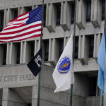 
              The American flag, the Commonwealth of Massachusetts flag, and the City of Boston flag, from left, fly outside Boston City Hall, Monday, May 2, 2022, in Boston. A unanimous Supreme Court has ruled that Boston violated the free speech rights of a conservative activist when it refused his request to fly a Christian flag on a flagpole outside City Hall. Justice Stephen Breyer wrote for the court Monday that the city discriminated against the activist because of his "religious viewpoint," even though it had routinely approved applications for the use of one of the three flagpoles outside City Hall that fly the U.S., Massachusetts and Boston flags. (AP Photo/Charles Krupa)
            