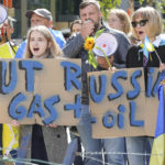 
              Ukrainian demonstrators demand an embargo on Russian oil during a protest in front of EU institutions prior to an extraordinary meeting of EU leaders to discuss Ukraine, energy and food security at the Europa building in Brussels, Monday, May 30, 2022. (AP Photo/Olivier Matthys)
            