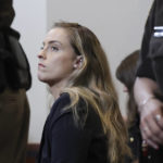 
              Whitney Henriquez, sister of actor Amber Heard, sits in the courtroom at the Fairfax County Circuit Courthouse in Fairfax, Va., Wednesday, May 25, 2022. Actor Johnny Depp sued his ex-wife Amber Heard for libel in Fairfax County Circuit Court after she wrote an op-ed piece in The Washington Post in 2018 referring to herself as a "public figure representing domestic abuse." (Evelyn Hockstein/Pool photo via AP)
            