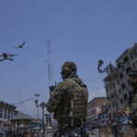 
              Paramilitary soldiers keep vigil in an area with the help of a drone during a shutdown in central Srinagar, Indian controlled Kashmir, Wednesday, May 25, 2022. Shops and business establishment in some parts of Srinagar remained closed ahead of the sentence hearing of Kashmiri separatist leader Yasin Malik. Malik is being tried on charges of terrorist acts, raising funds, conspiracy, a member of a terrorist organization, and criminal conspiracy and sedition.(AP Photo/Dar Yasin)
            