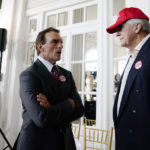 
              Former NFL football player, Doug Flutie, left, speaks with Keith Boyles during an election night watch party for U.S. Senate candidate Herschel Walker, Tuesday, May 24, 2022, in Atlanta. (AP Photo/Brynn Anderson)
            