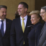 
              Cyprus President Nicos Anastasiades, right, with his wife Antri, and Luxembourg's Prime Minister Xavier Bettel, left, with his partner Gauthier Destenay are seen before their meeting at the presidential palace in the capital Nicosia, Cyprus, Thursday, May 5, 2022. Bettel's visit comes amid Russia's ongoing war in Ukraine which he will discuss with the Cypriot president, as well as the European Union's efforts to reduce its dependence on Russian oil and gas. (AP Photo/Petros Karadjias)
            