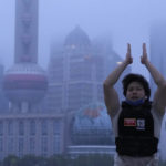 
              A resident exercises along the bund as day breaks, Wednesday, June 1, 2022, in Shanghai. Shanghai authorities say they will take major steps Wednesday toward reopening China's largest city after a two-month COVID-19 lockdown that has set back the national economy and largely confined millions of people to their homes. (AP Photo/Ng Han Guan)
            