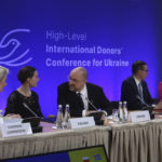 
              Ukrainian Prime Minister Denys Szmyhal, center, talks to President of the European Commission Ursula von der Leyen, left, and Prime Minister of Finland, Sanna Marin, 2nd left, at the High-Level International Donor's Conference for Ukraine at the National Stadium in Warsaw, Poland, Thursday, May 5, 2022. The conference aims to raise funds for Ukraine's growing humanitarian needs. Poland and Sweden want to encourage their partners to jointly respond to the difficult humanitarian situation in Ukraine. (AP Photo/Michal Dyjuk)
            