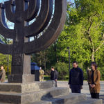 
              German foreign minister Annalena Baerbock and Deputy Minister for Foreign Affairs of Ukraine Mykola Tochytskyi mourn at the Menorah monument in Babi Yar ravine, where Nazi troops machine-gunned many thousands of Jews during WWII, in Kyiv, Ukraine, Tuesday, May 10, 2022. (AP Photo/Efrem Lukatsky)
            